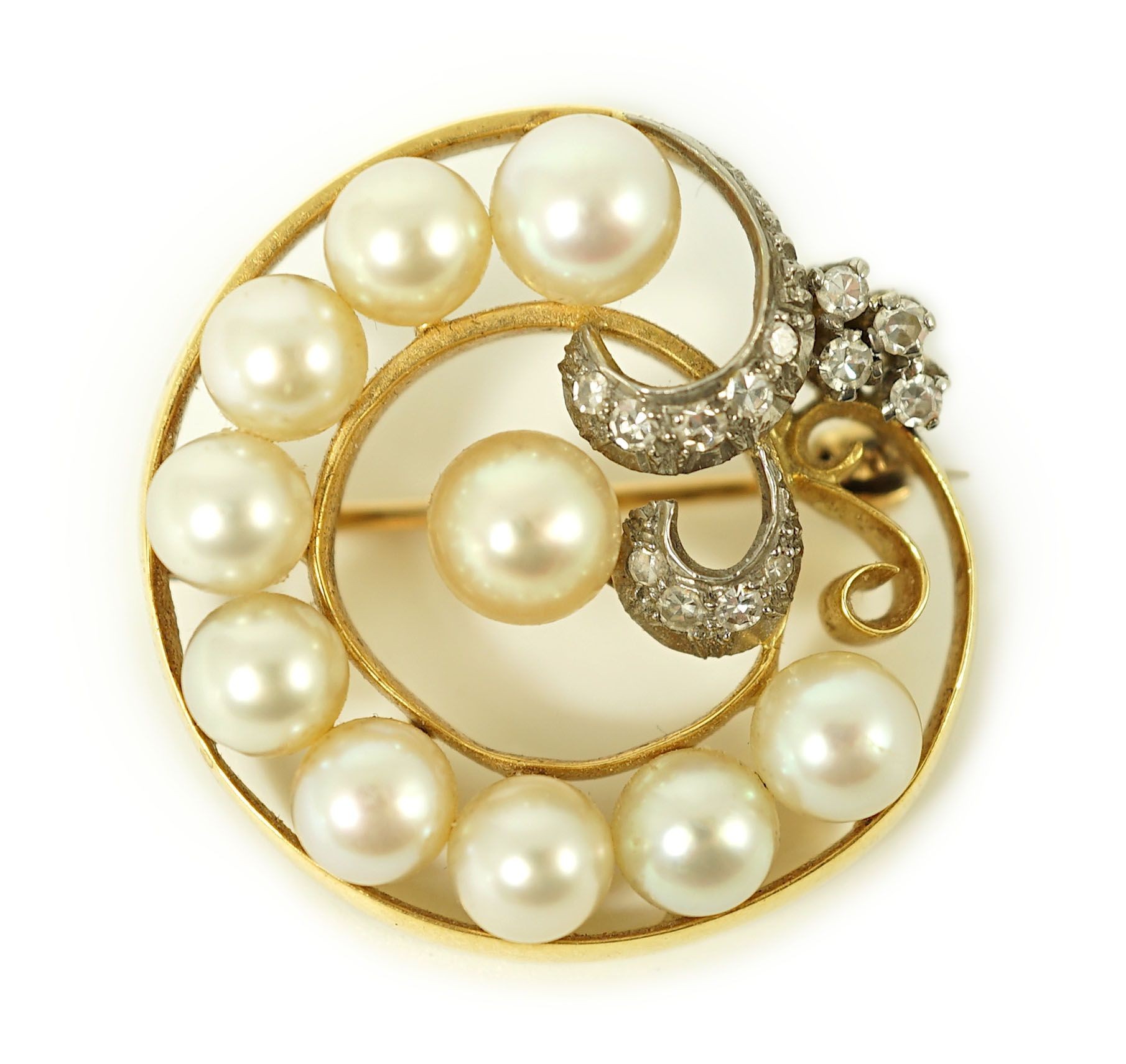 A 20th century gold, cultured pearl and diamond set open work scroll brooch